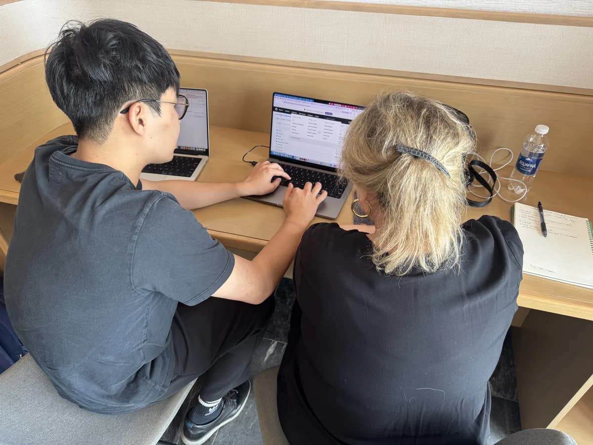 Maureen building lead magnets and a marketing agent team at a private AI retreat for non-technical founders.