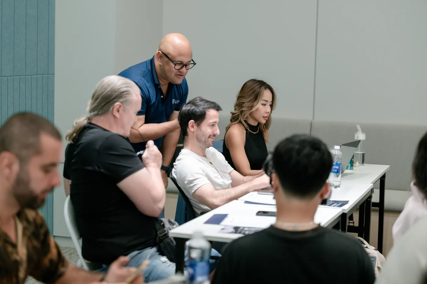 Dave coaching a group of executives at a table