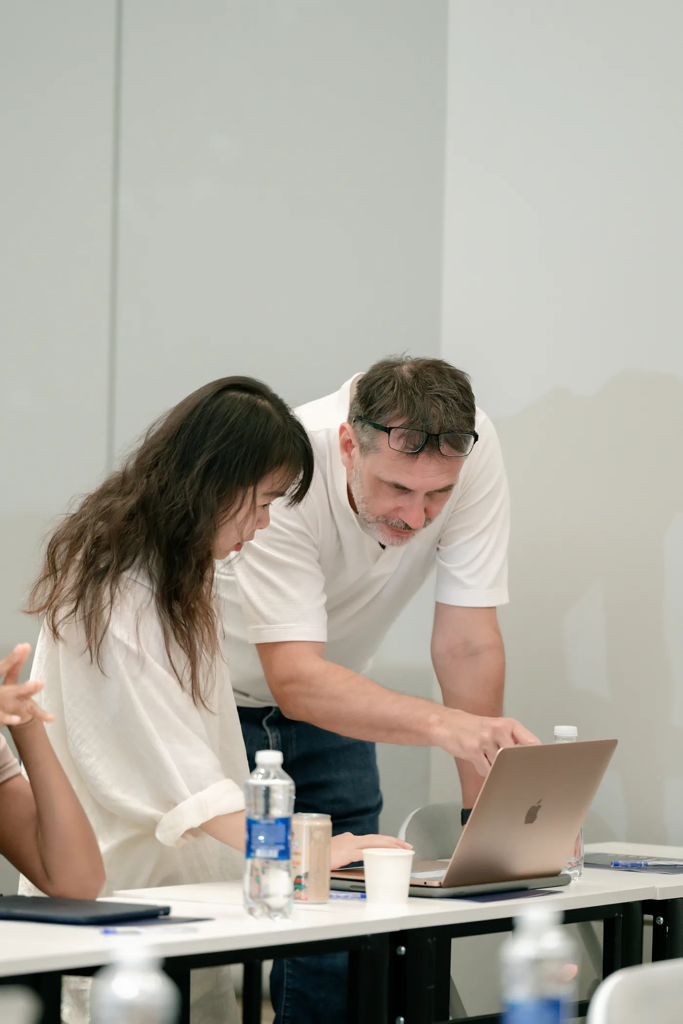 One-on-one mentoring at a laptop