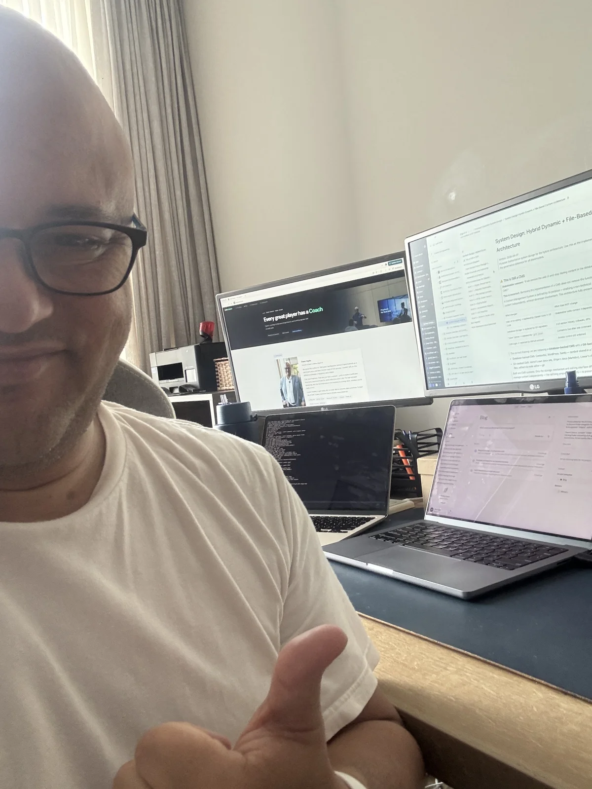 Dave Hajdu at his desk with multiple screens running parallel AI workflows